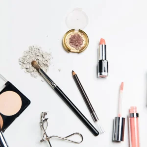 A table topped with makeup and eye shadows.