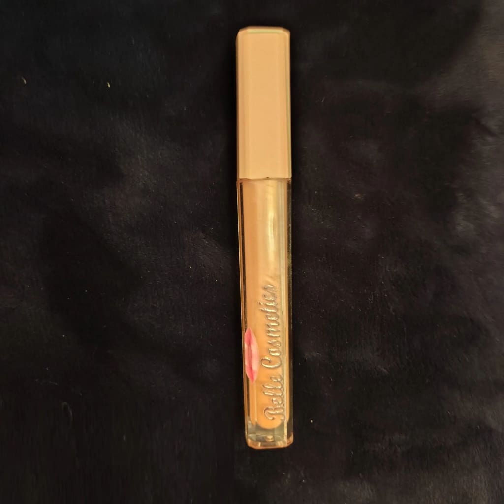 A close up of the top of a tube of lip gloss