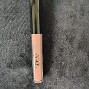 A close up of the top of a lip gloss