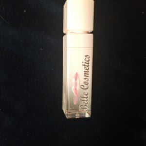 A tube of white cosmetics is sitting on the table.