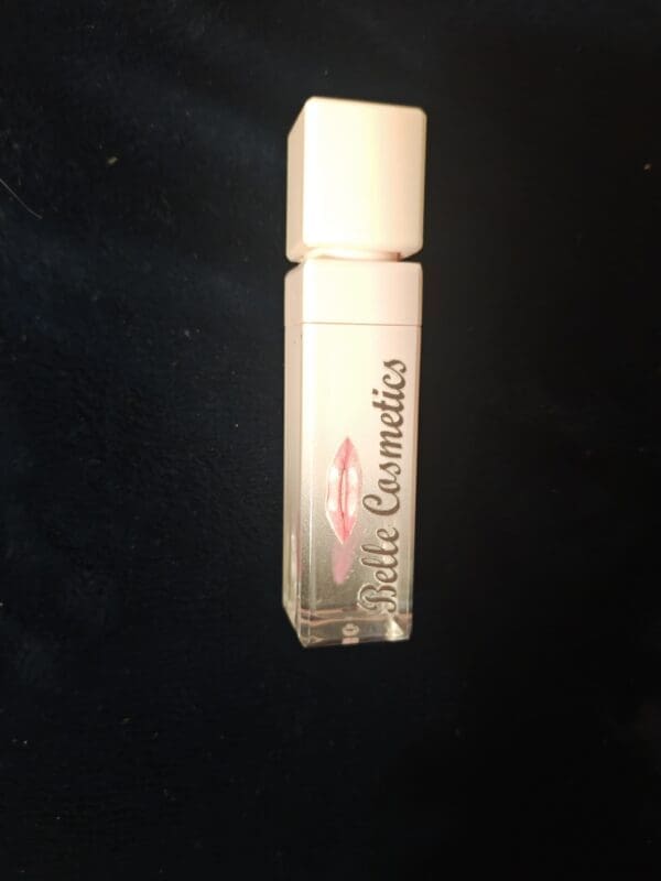 A tube of white cosmetics is sitting on the table.